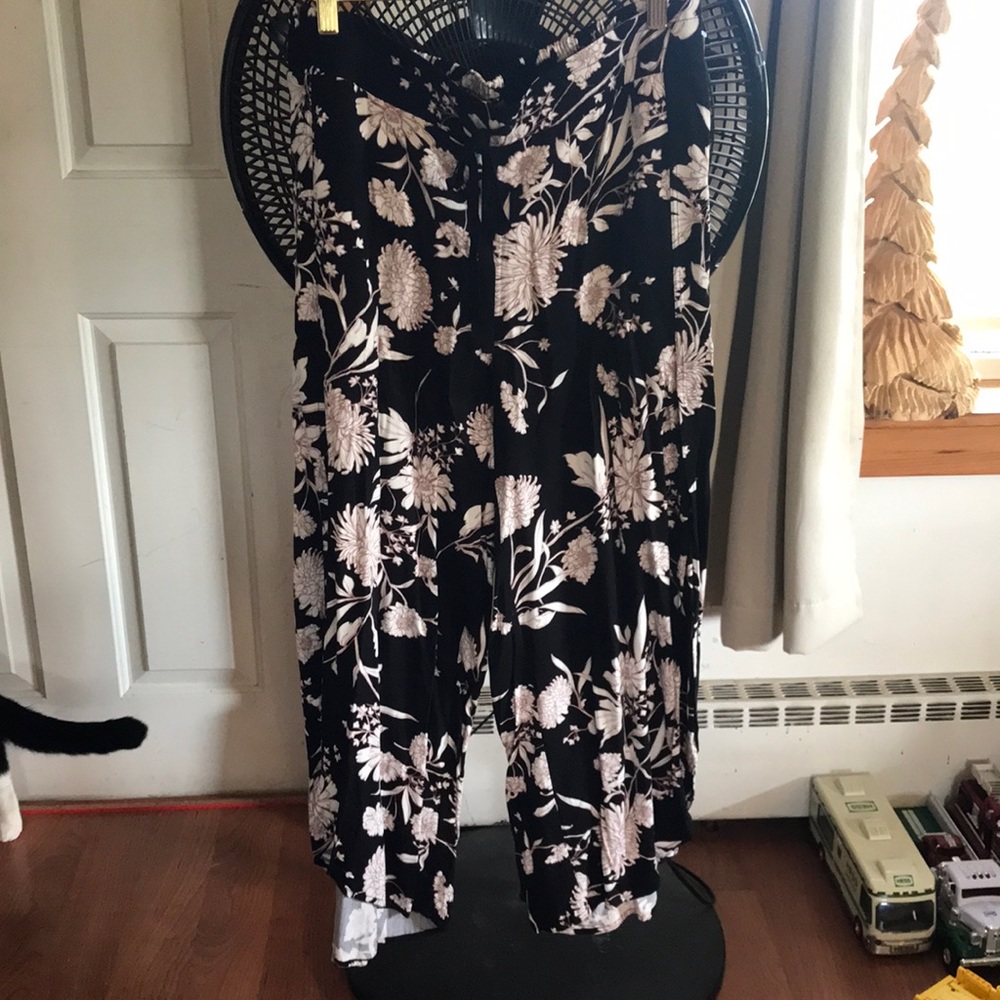 Maurice’s dress pants, black background, ivory flower outlined light pink size L